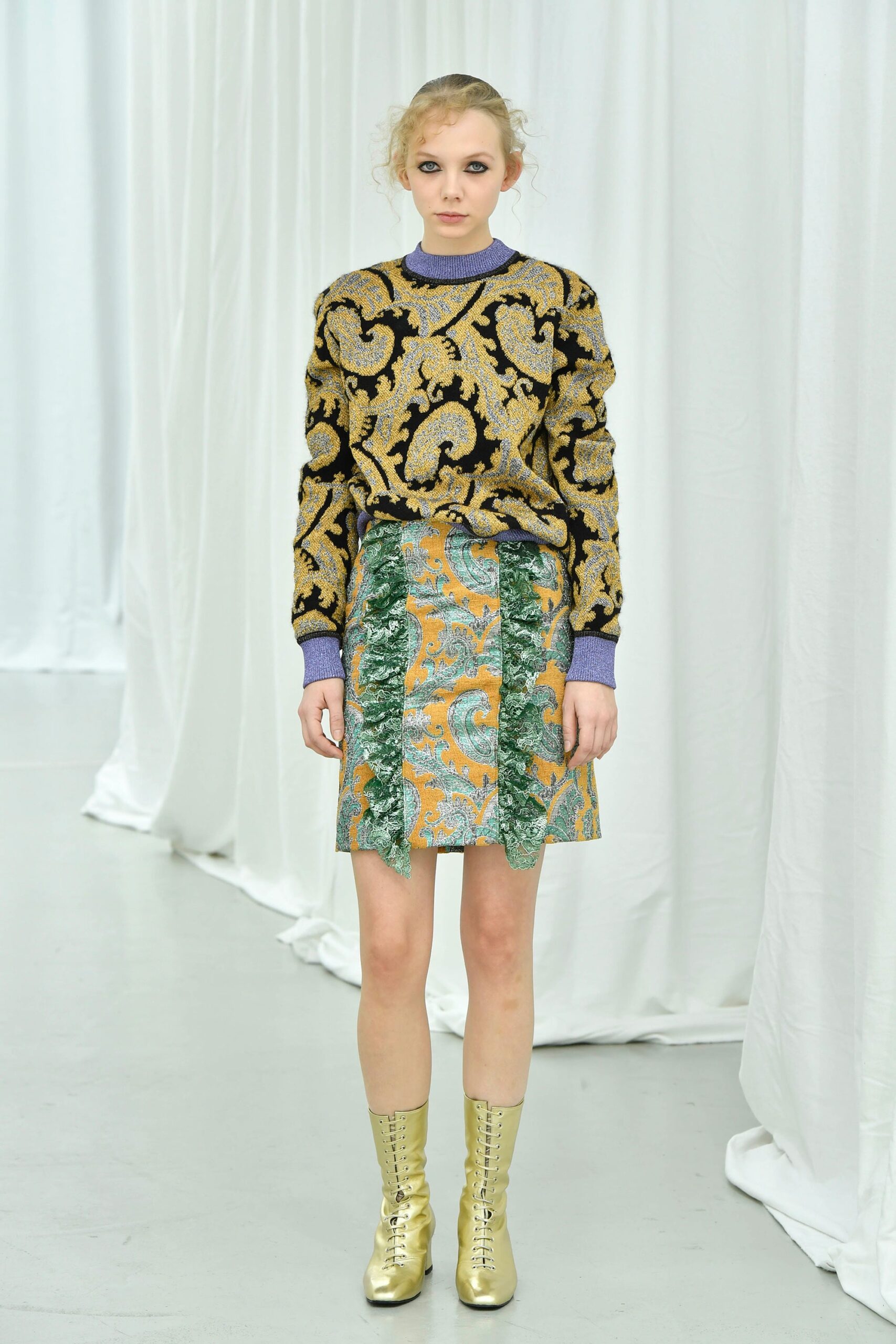 fitted black gold printed sweater and mini skirt