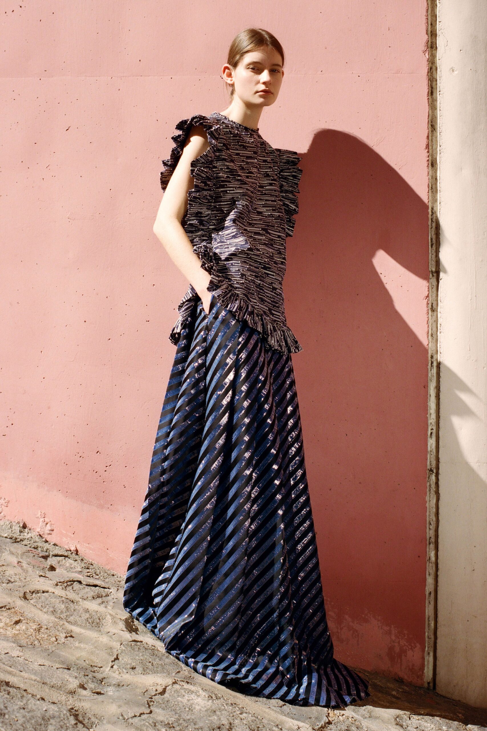fitted silk top and pleated skirt
