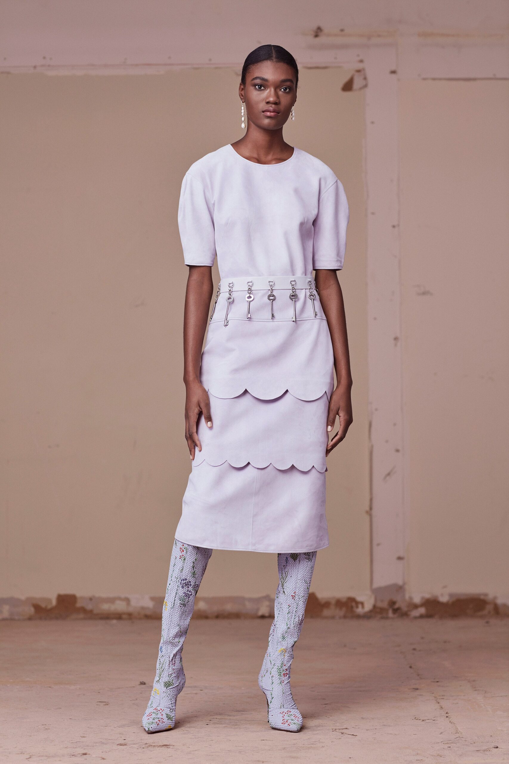 lavender fitted midi dress with textured boots