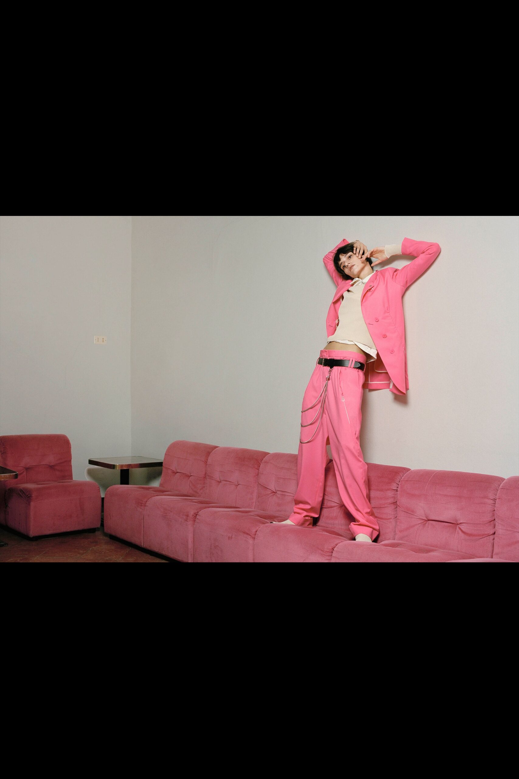 pink fitted suit with beige top