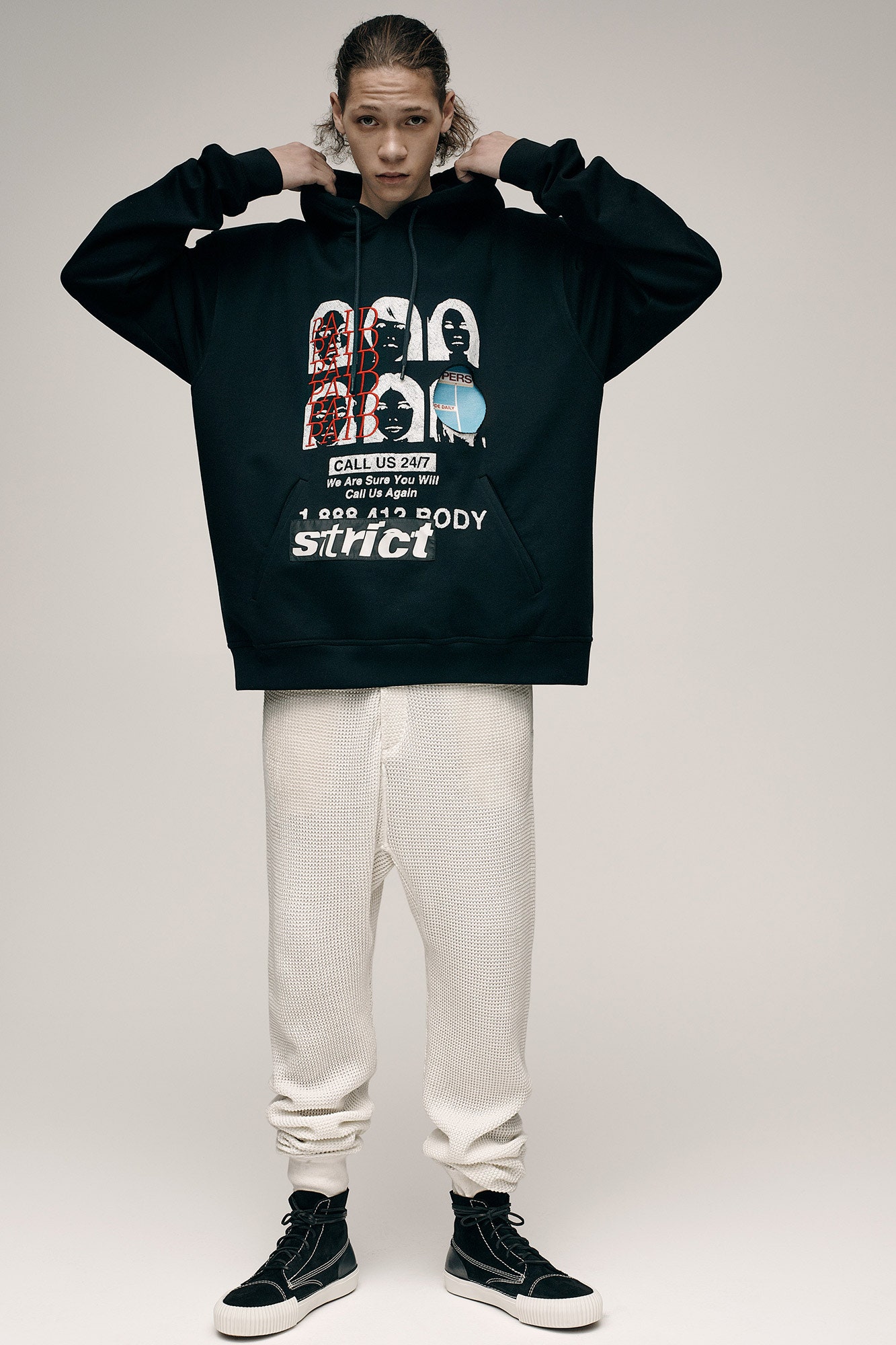 black oversized hoodie and white pants