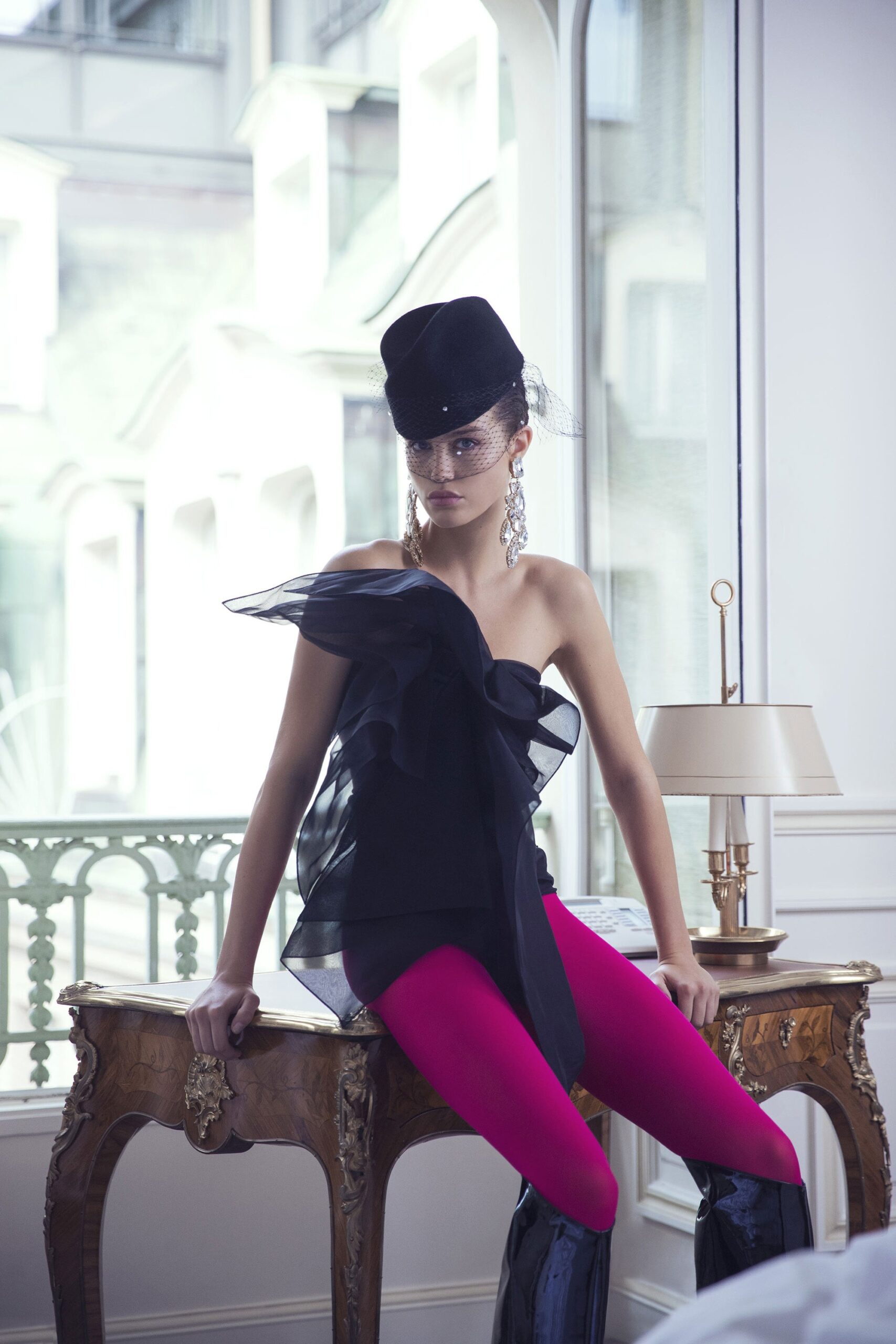 black ruffled top with pink leggings