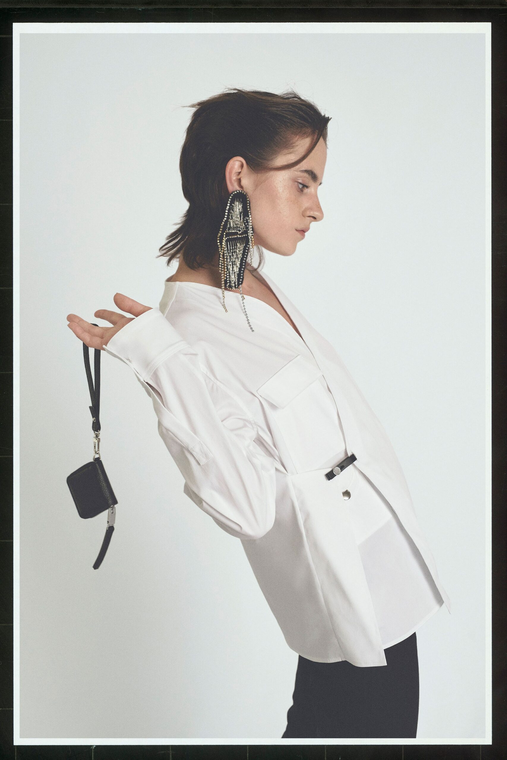 white relaxed shirt and black pants