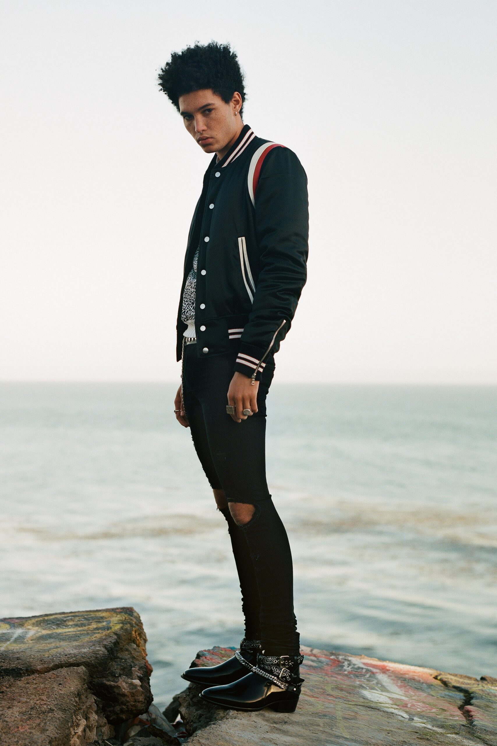 black fitted jacket with distressed pants