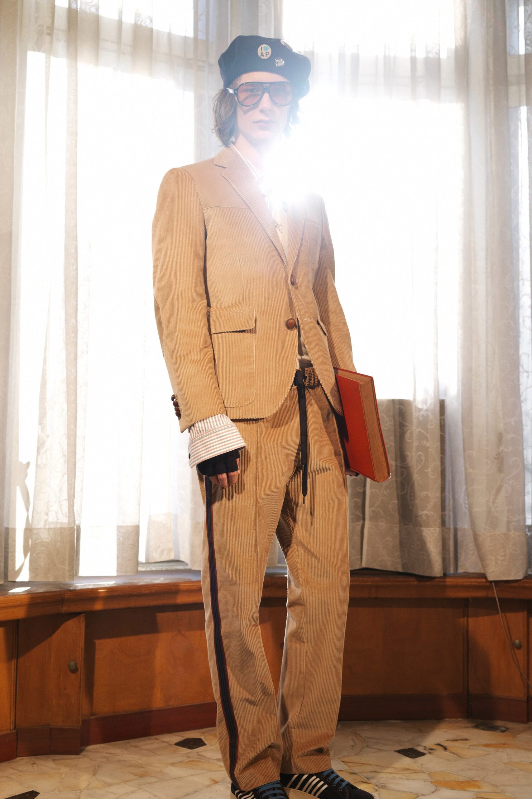 beige tailored suit with striped shirt