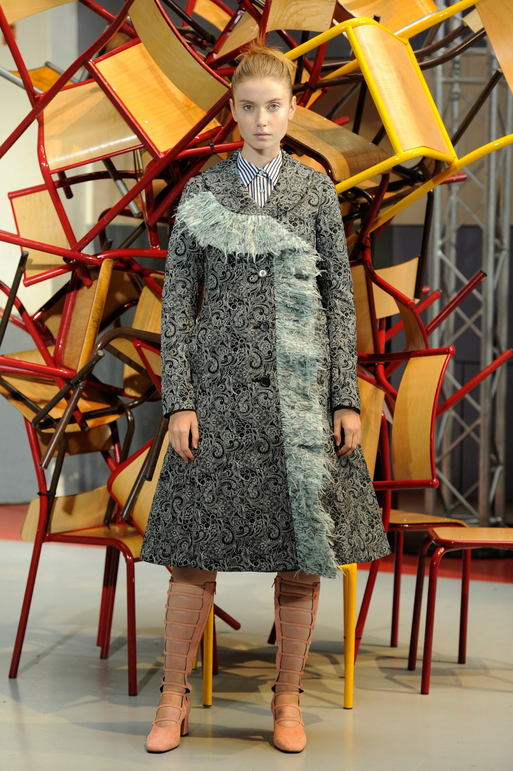 black embroidered midi coat with pink boots