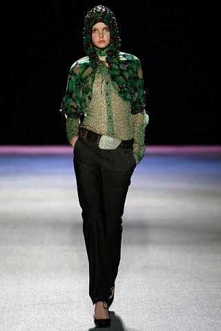 green embroidered blouse with black pants