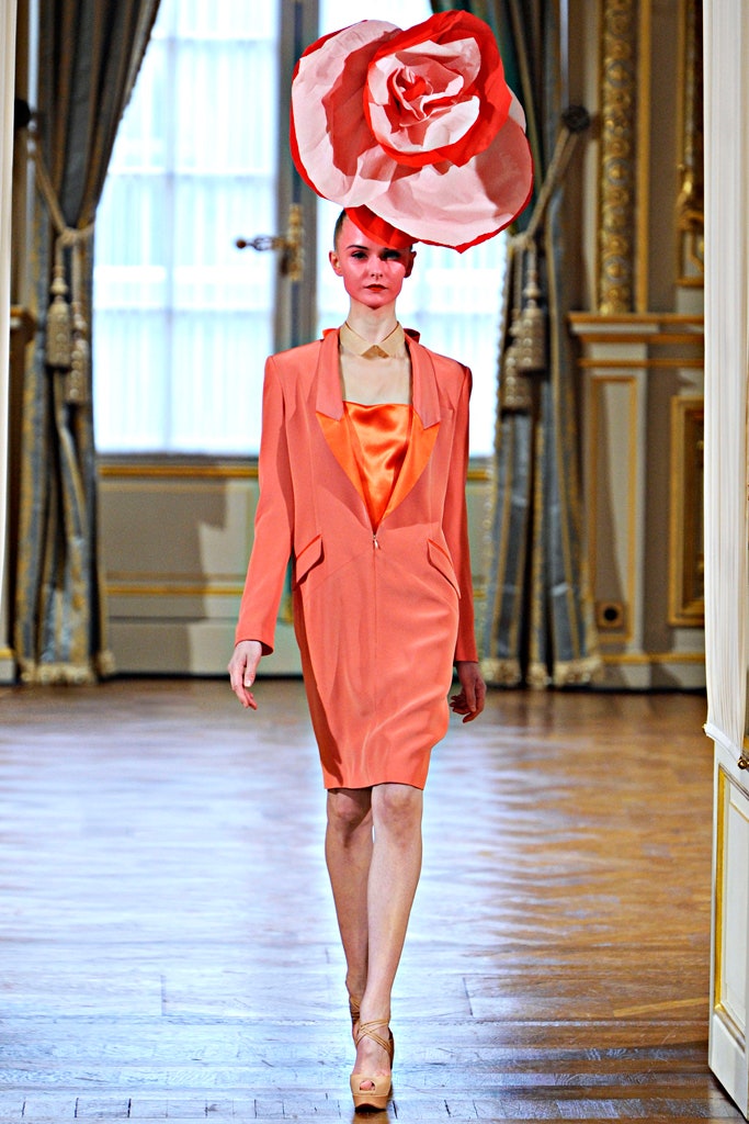 orange fitted mini dress with floral hat