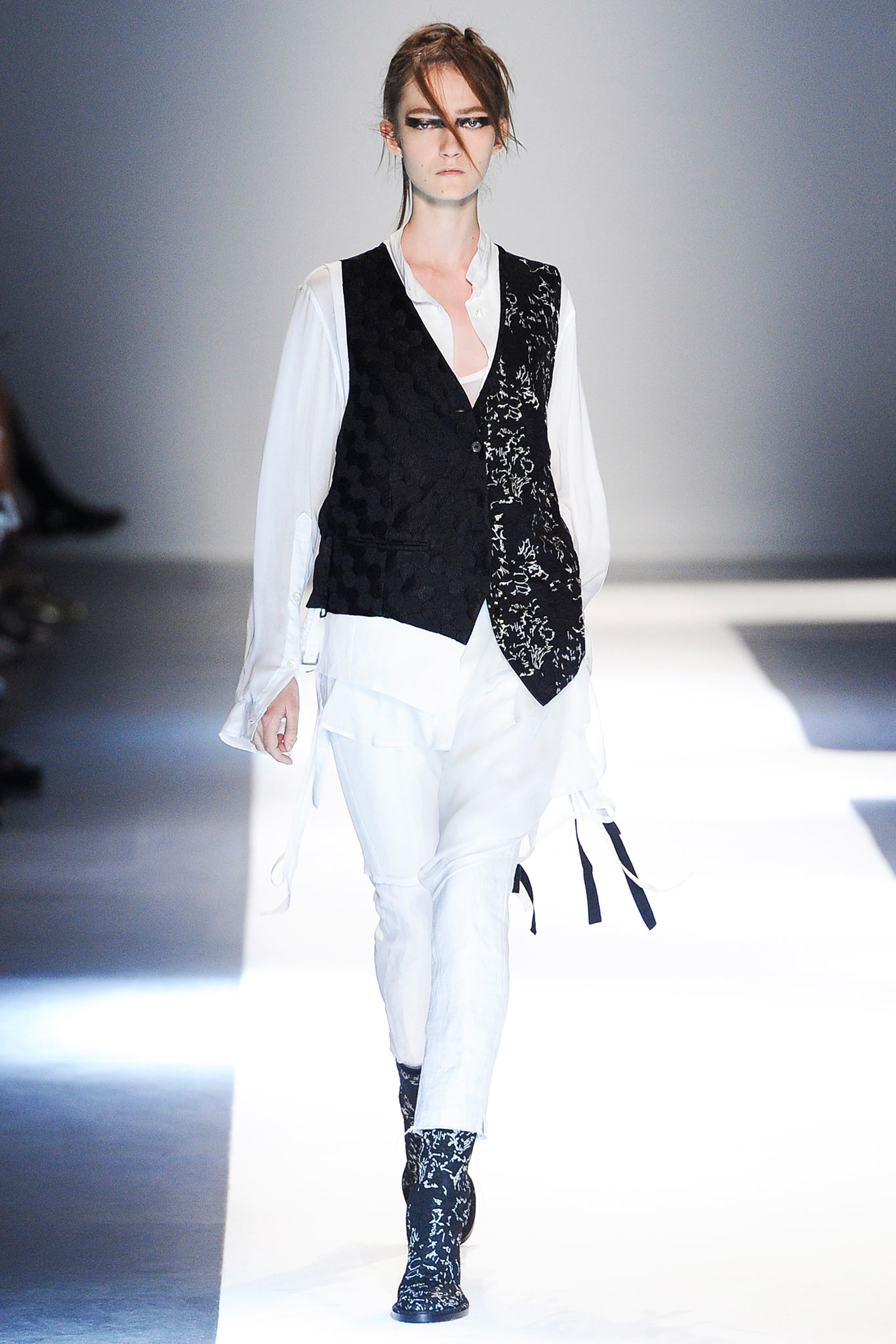 black embroidered vest with white shirt