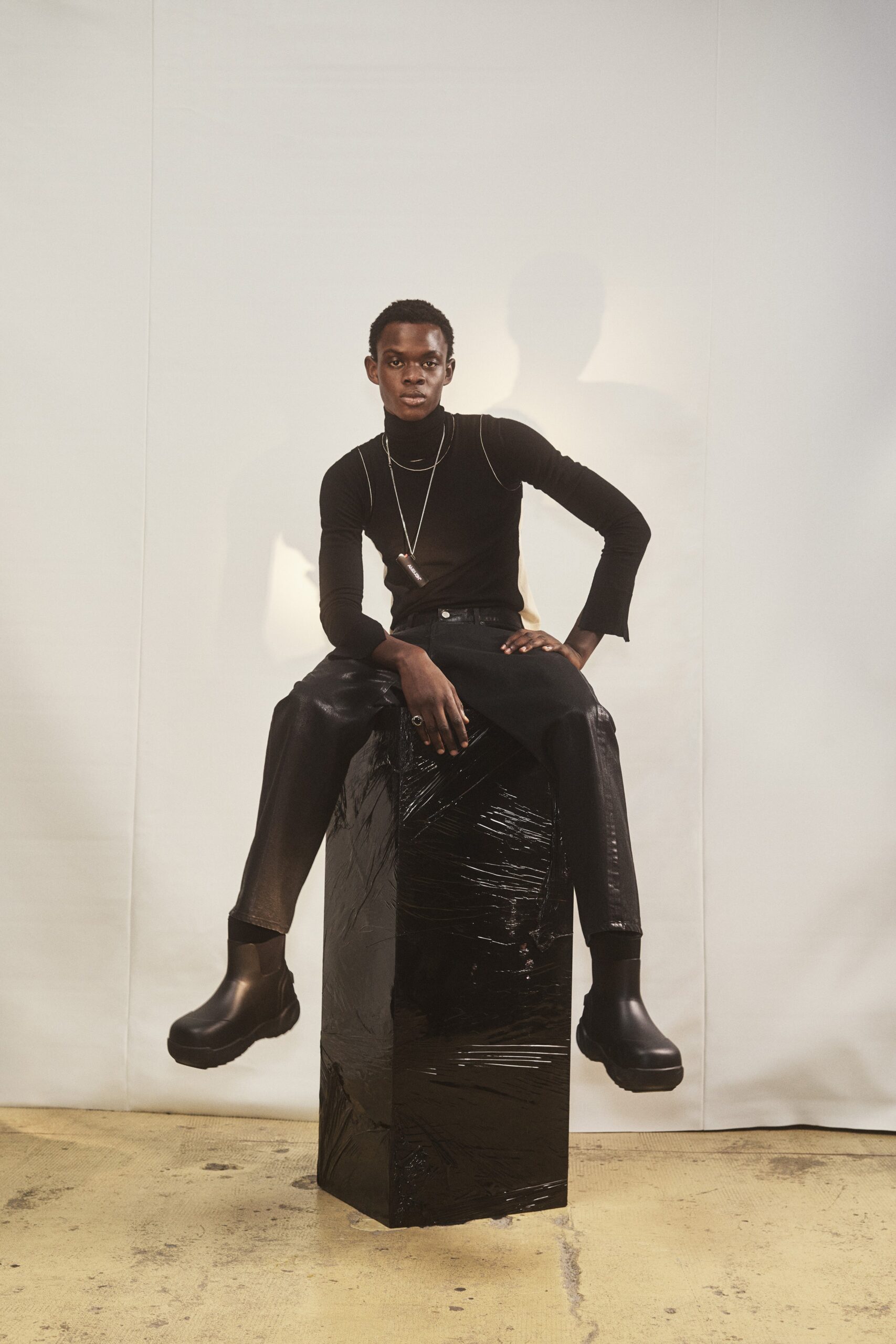 black fitted top and tailored pants