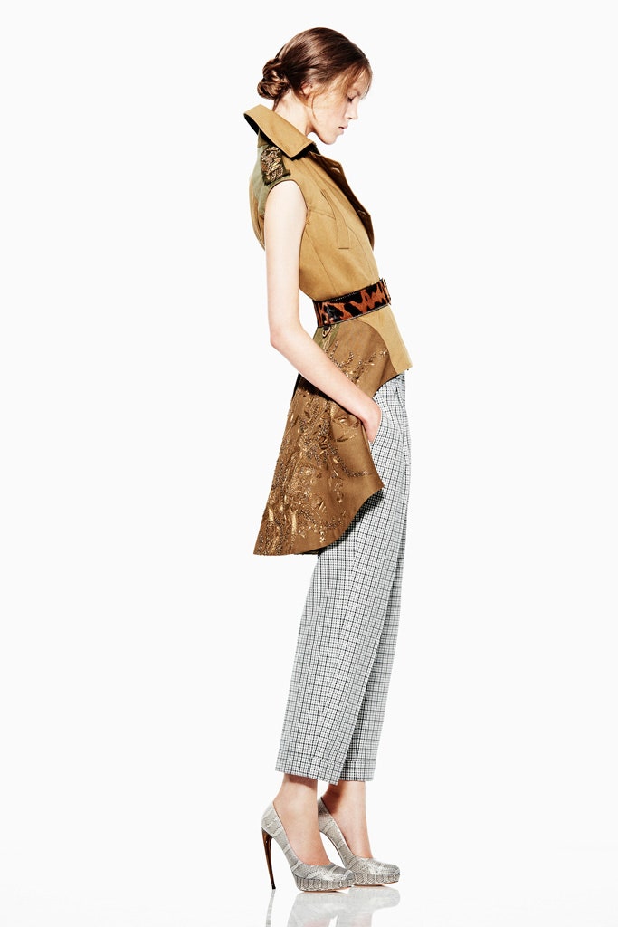 brown embroidered vest with gray pants