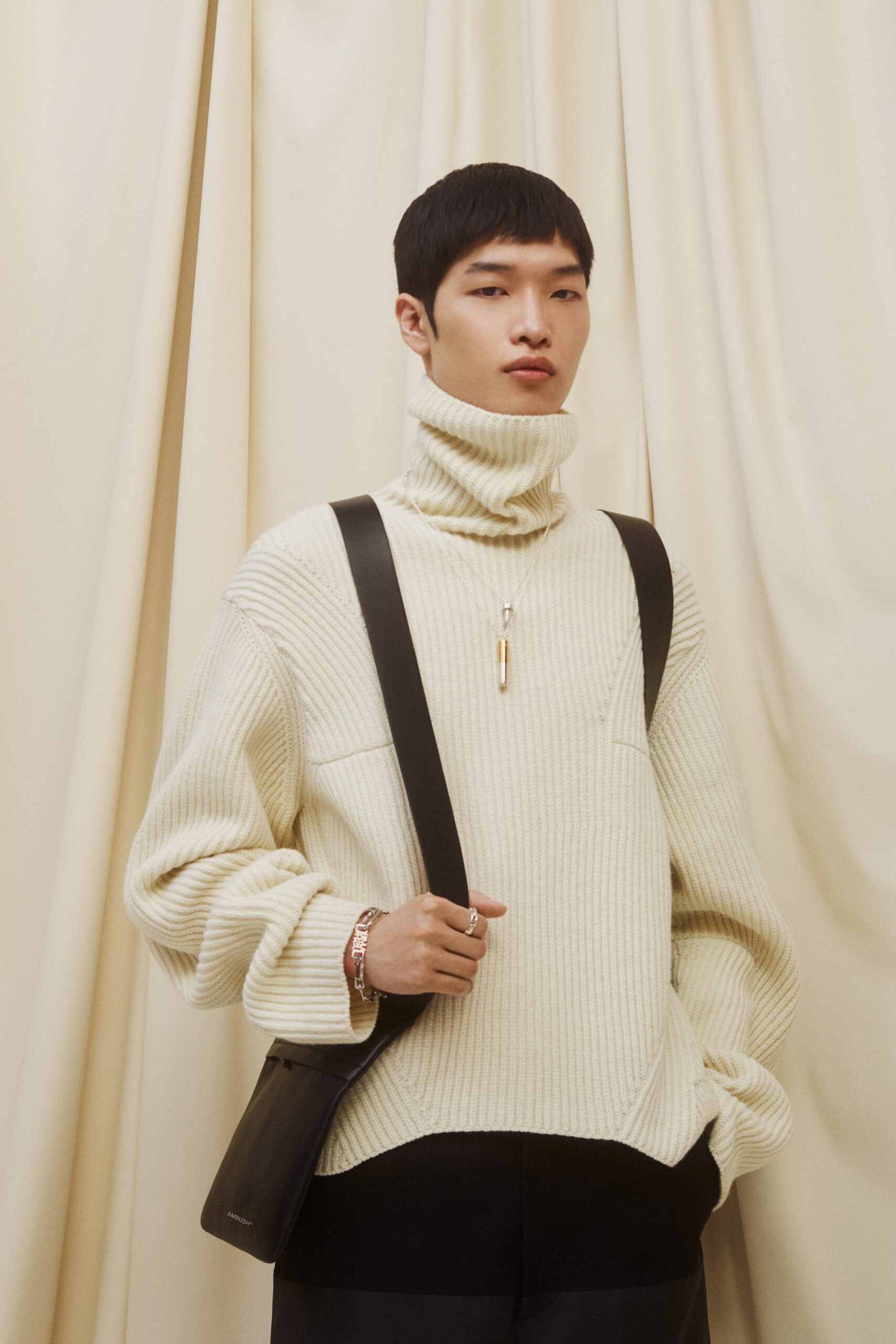 beige oversized sweater with black pants