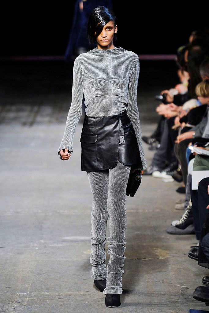 gray fitted knit top with black leather skirt