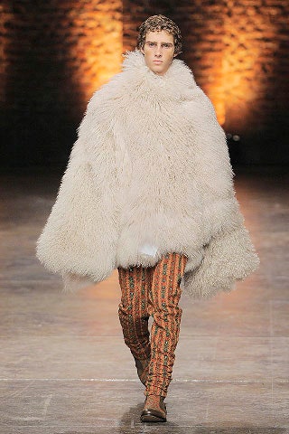 white fur cape with striped pants