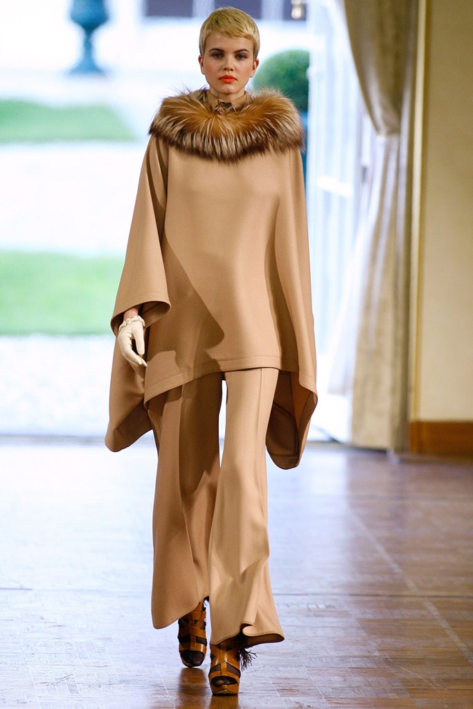 beige wool cape and flared pants