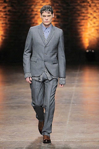 gray tailored suit with blue shirt