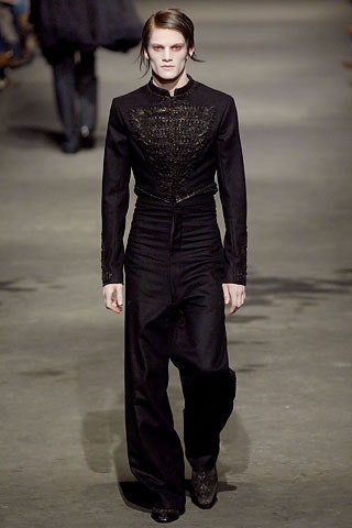 fitted black suit with pleats