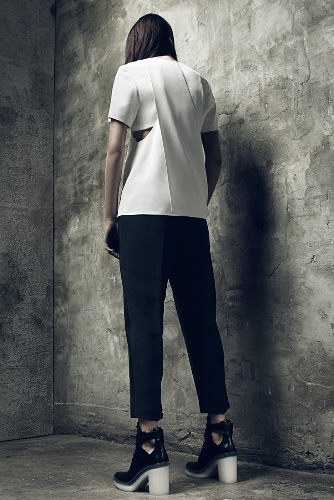 white fitted top with black tailored pants