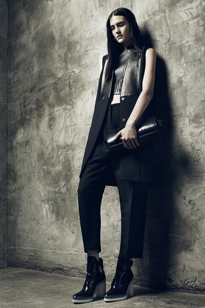 black leather sleeveless high-neck fitted zippered vest