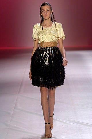 yellow ruffled top with black tiered skirt