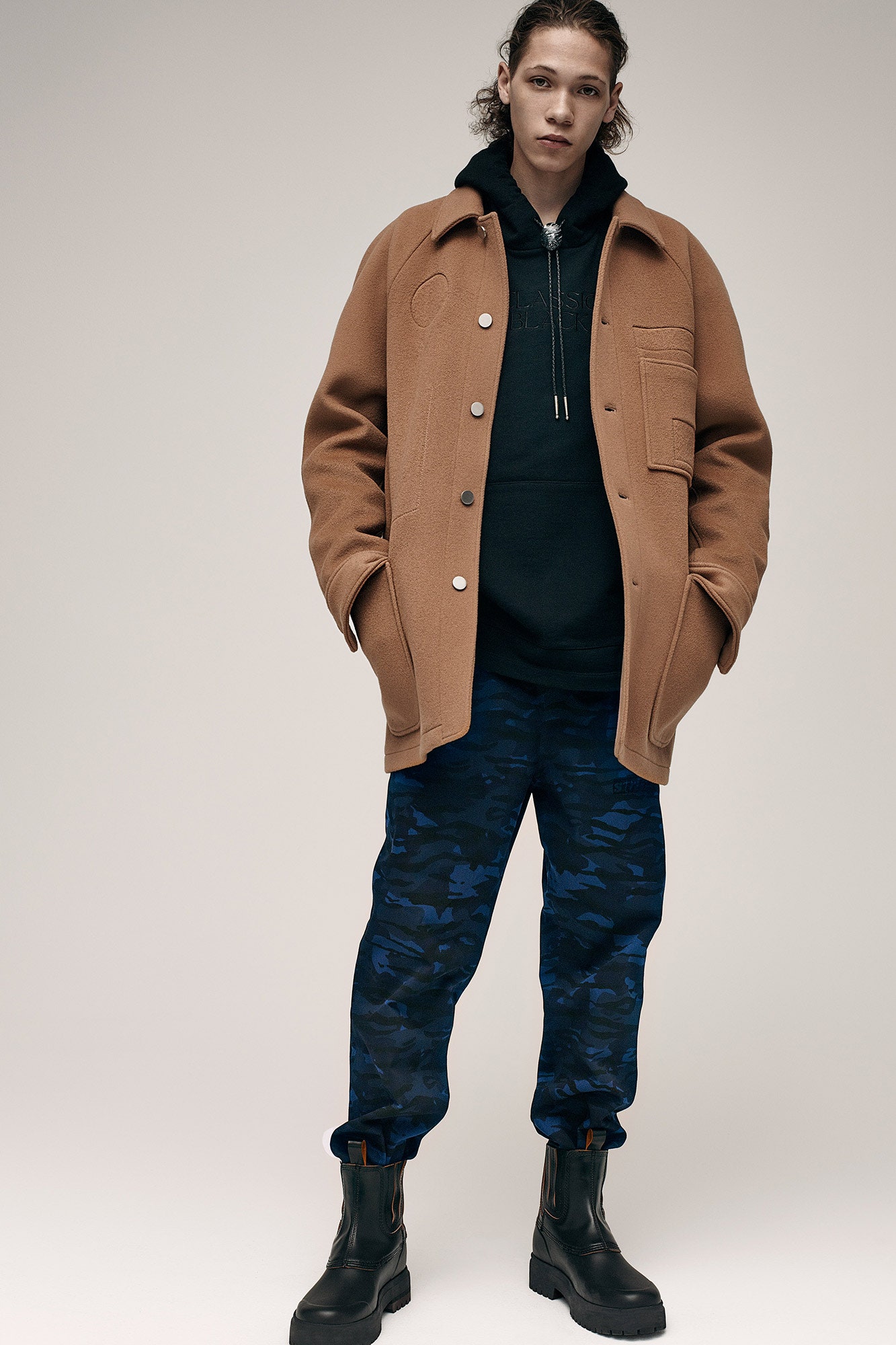 brown wool coat with black hoodie
