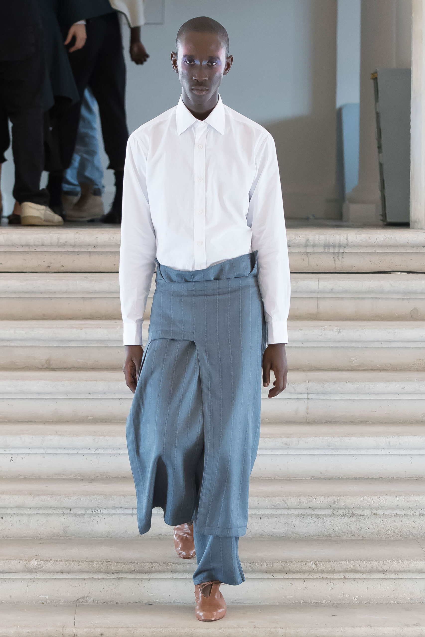 white fitted shirt with blue pants