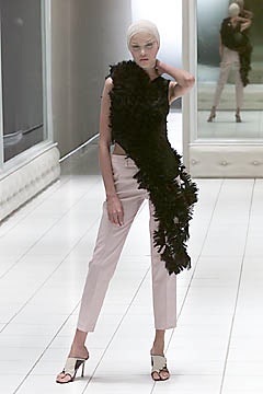 black ruffled top with pink pants