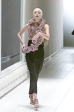 pink silk sleeveless top with black pants