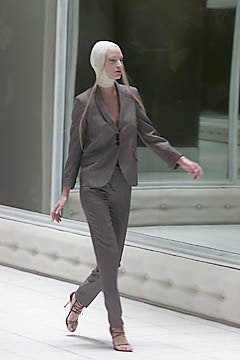 gray tailored suit with strappy shoes