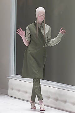 green fitted midi dress and pants