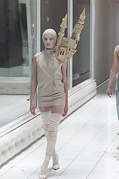 beige fitted mini dress with white boots