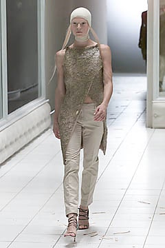 beige asymmetric top with slim pants
