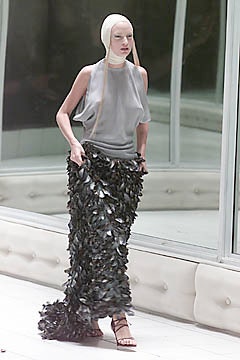 gray silk sleeveless top and black feather skirt