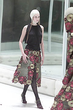 black fitted top and flared skirt