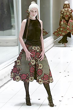 black silk sleeveless top and multi flared skirt