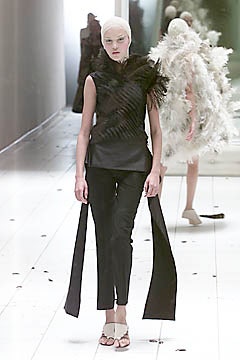 black silk fitted top and tailored pants