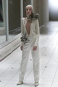 white fitted jumpsuit with pointed shoes