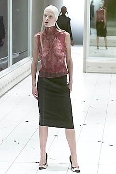 fitted red silk top and black leather skirt
