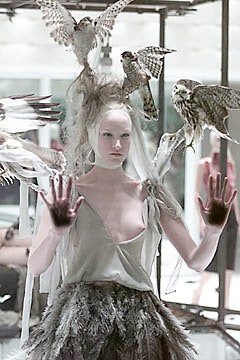 gray silk sleeveless dress with feathered skirt