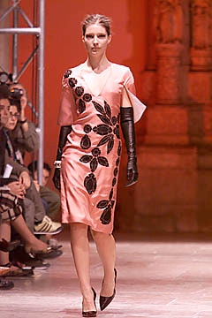 pink fitted dress with black gloves
