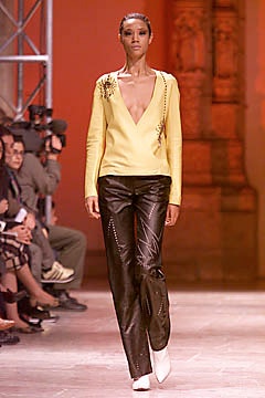 yellow fitted top with black pants