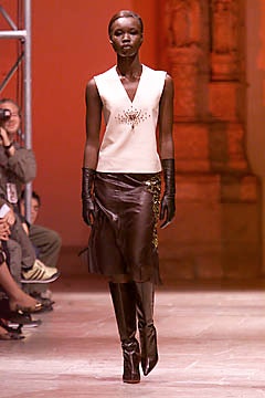 white silk sleeveless top with brown leather skirt