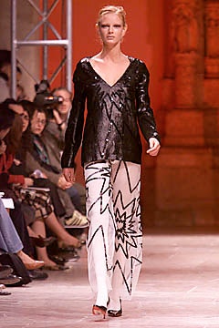 black sequined top with flared pants