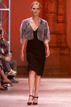 black silk fitted dress with gray cape