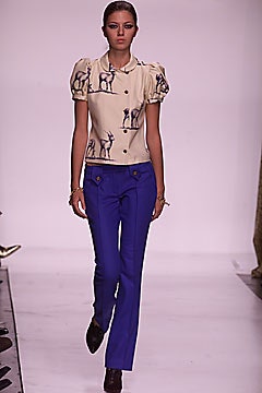 beige printed blouse with blue pants