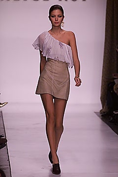 white pleated asymmetric top and beige mini skirt