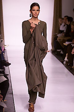 green fitted jumpsuit with cape
