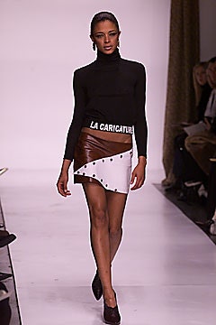 black fitted turtleneck and asymmetric skirt