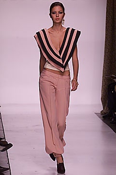 pink striped sleeveless top and beige pants