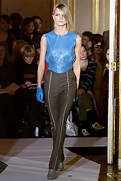 blue fitted top with gray pants